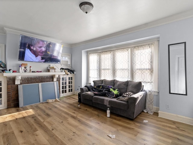 living room with hardwood / wood-style flooring and ornamental molding