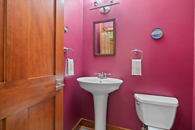 bathroom with sink and toilet