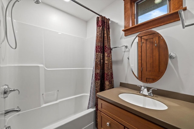 bathroom with shower / tub combo with curtain and vanity