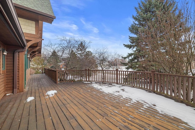 view of snow covered deck