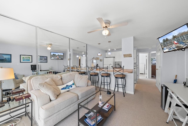 living room with light carpet and ceiling fan