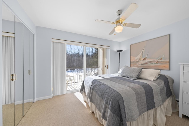 carpeted bedroom with ceiling fan, access to exterior, and a closet