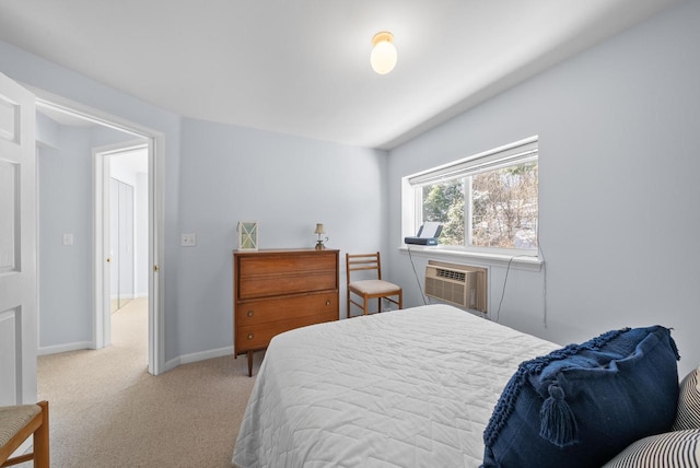 carpeted bedroom featuring an AC wall unit