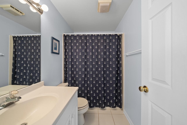 bathroom featuring walk in shower, vanity, tile patterned floors, and toilet