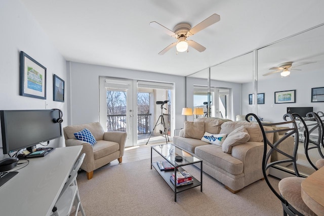 living room with ceiling fan and french doors