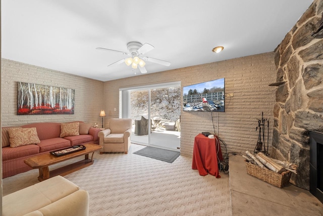 carpeted living room featuring ceiling fan