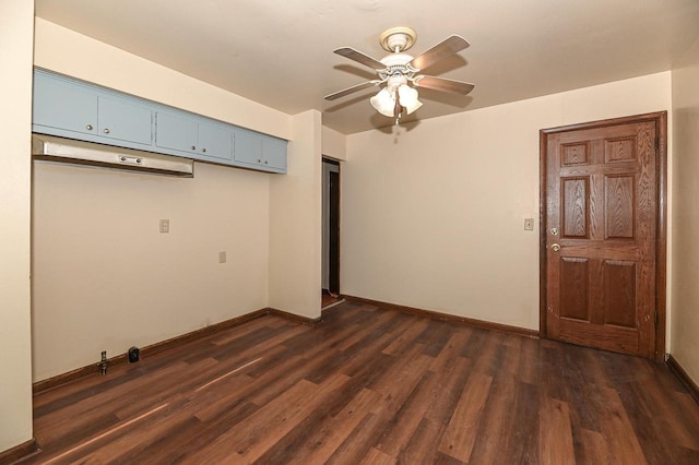 spare room featuring dark hardwood / wood-style floors and ceiling fan