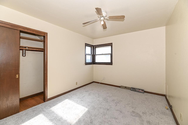 unfurnished bedroom featuring a closet, ceiling fan, and carpet