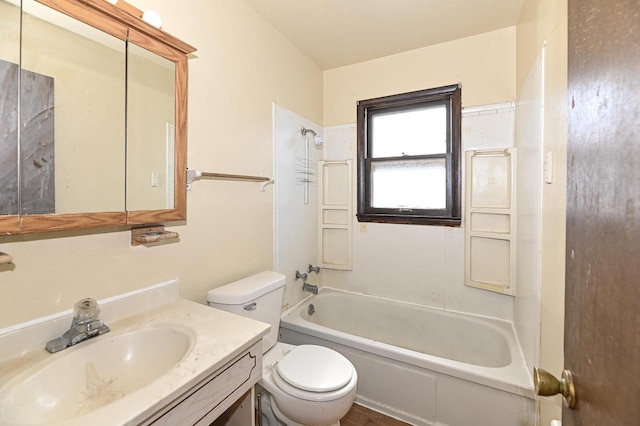 full bathroom featuring vanity, bathing tub / shower combination, and toilet