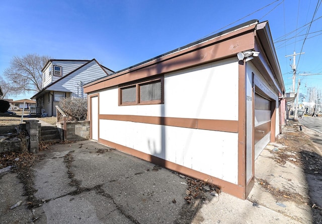 view of side of property with a garage