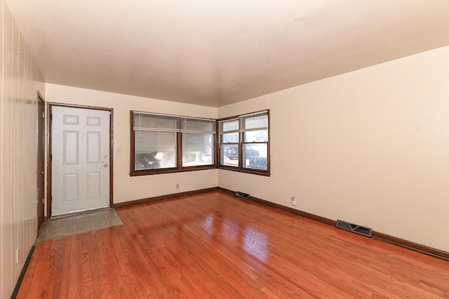 spare room featuring light wood-type flooring