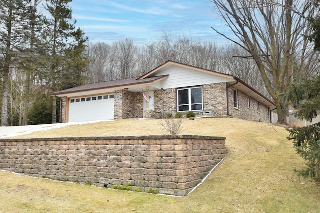 ranch-style house with a garage and a front lawn