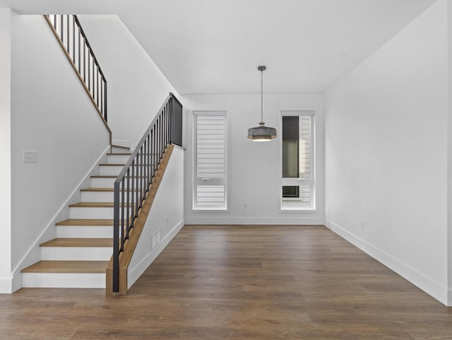 entrance foyer with dark hardwood / wood-style floors