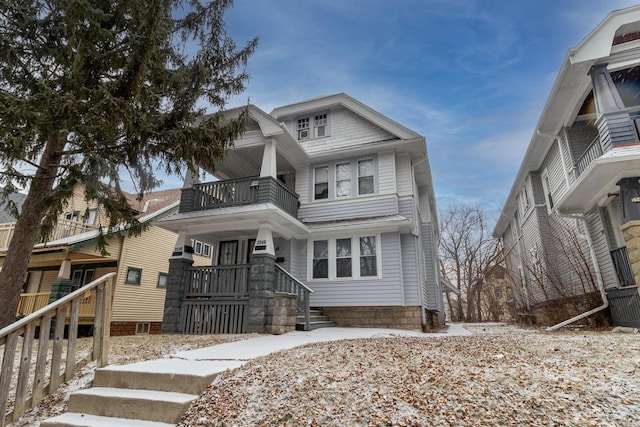 view of front of property with a balcony