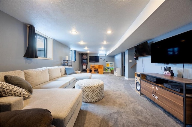 living room featuring carpet flooring and a textured ceiling