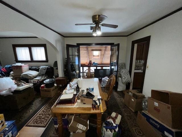 dining area with ceiling fan and ornamental molding