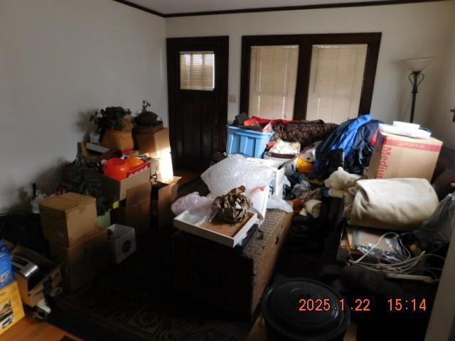 living room featuring hardwood / wood-style floors and ornamental molding