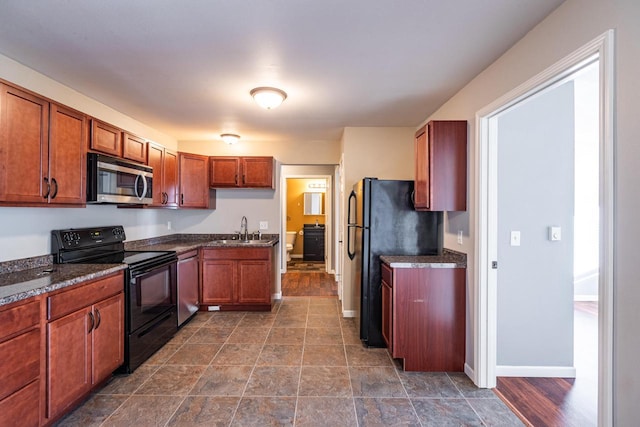 kitchen featuring sink and black appliances