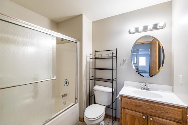 full bathroom featuring bath / shower combo with glass door, vanity, and toilet