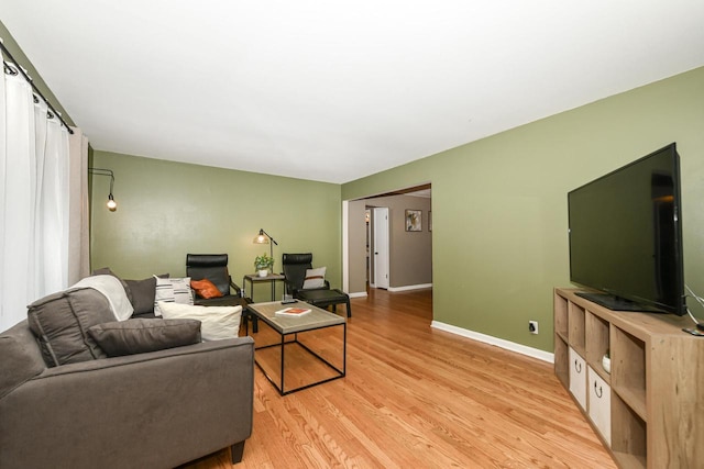 living room with light hardwood / wood-style flooring