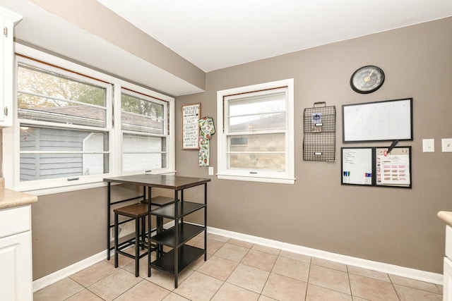 dining area featuring light tile patterned floors