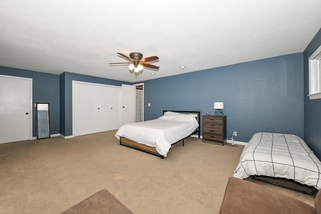 bedroom with light carpet and ceiling fan