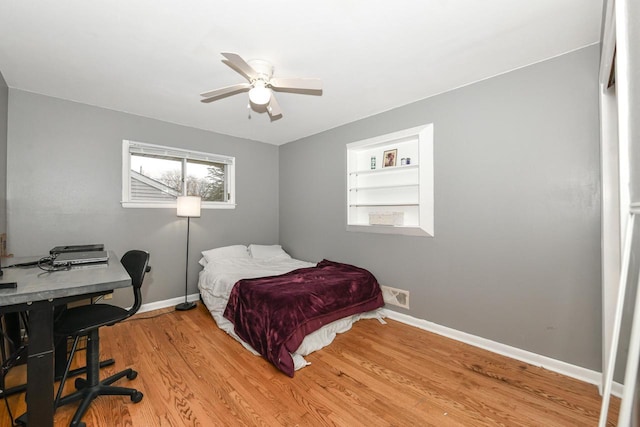 bedroom with ceiling fan and light hardwood / wood-style flooring