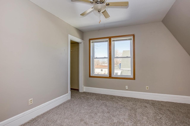 bonus room featuring light colored carpet and ceiling fan