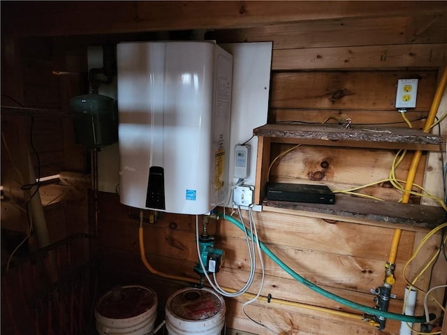 utility room featuring water heater