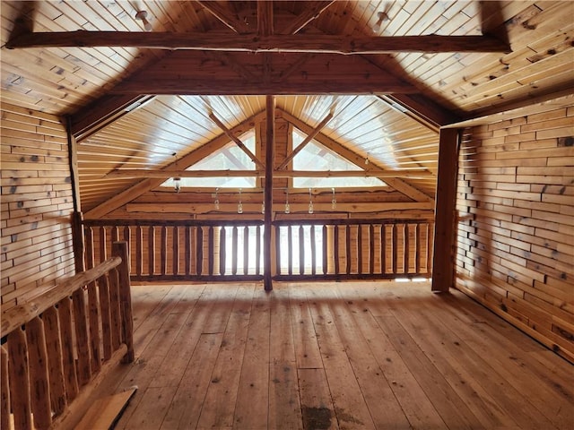 additional living space featuring lofted ceiling with beams, wood-type flooring, and wooden ceiling