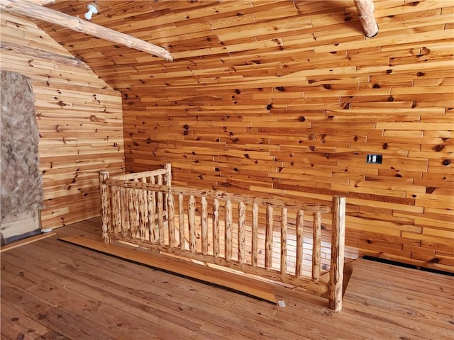 bonus room with lofted ceiling, wood walls, wood-type flooring, and wood ceiling