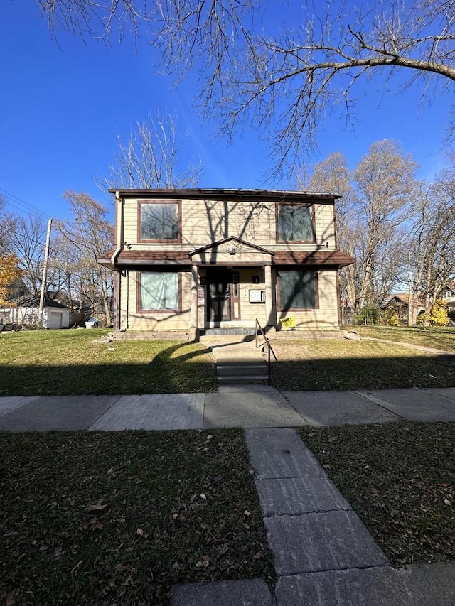 view of front of property with a front lawn