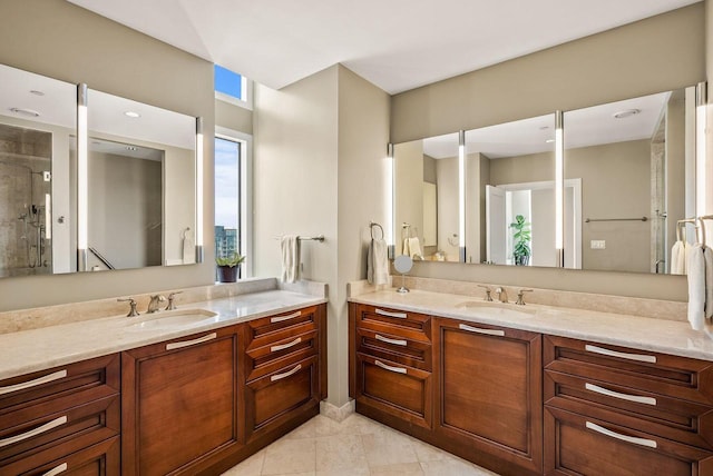 bathroom featuring a shower with door and vanity