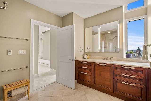 bathroom with walk in shower and vanity