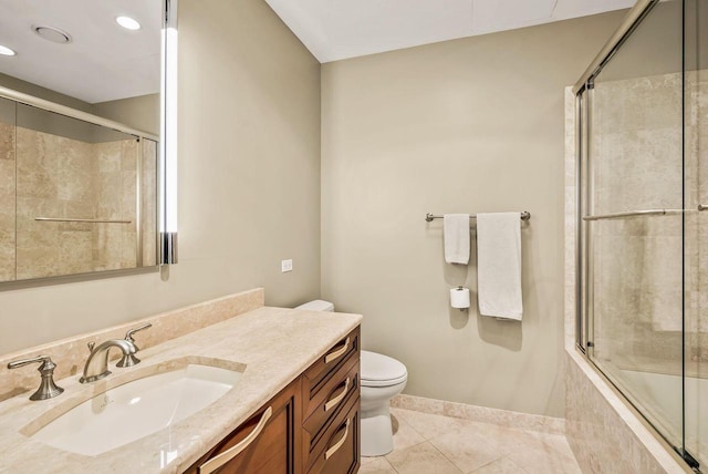 full bathroom with vanity, toilet, tile patterned flooring, and combined bath / shower with glass door