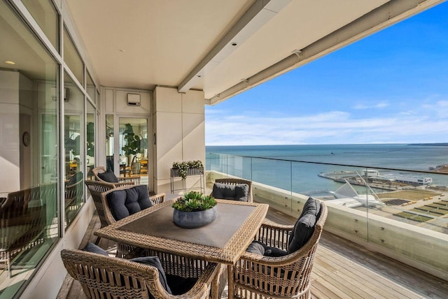 balcony featuring a water view