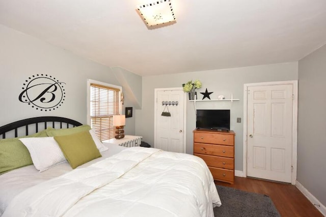 bedroom with hardwood / wood-style floors