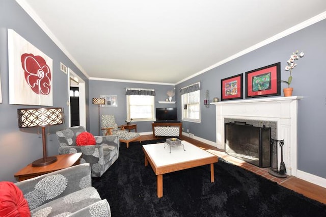 living room with wood-type flooring and ornamental molding