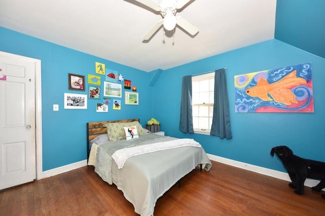 bedroom with dark hardwood / wood-style floors and ceiling fan