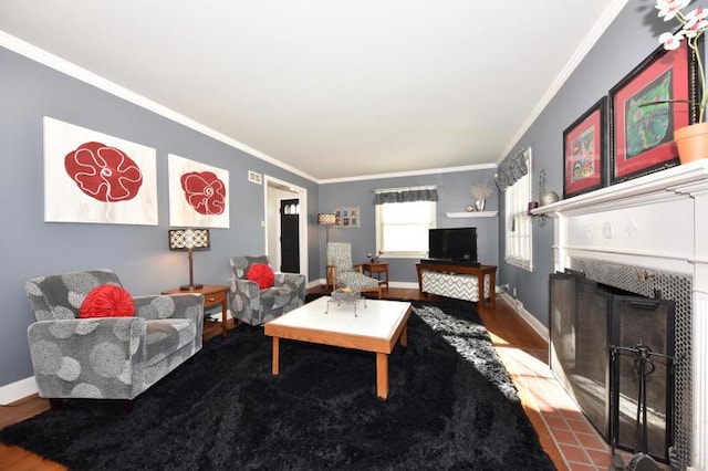 living room with crown molding, hardwood / wood-style floors, and a fireplace