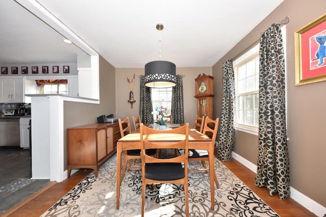 dining area with wood-type flooring