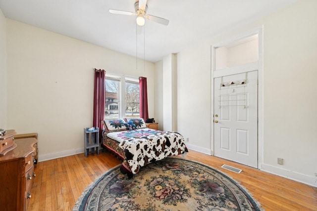 bedroom with hardwood / wood-style floors and ceiling fan