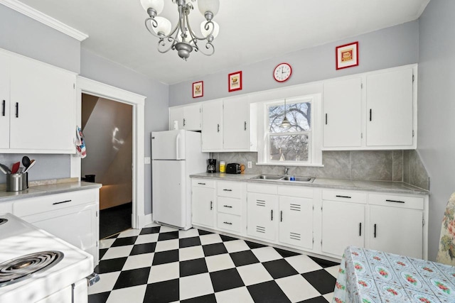 kitchen featuring tasteful backsplash, white appliances, sink, and white cabinets