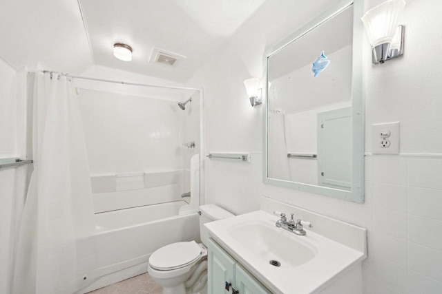 full bathroom featuring toilet, tile walls, vanity, shower / bathtub combination with curtain, and tile patterned flooring