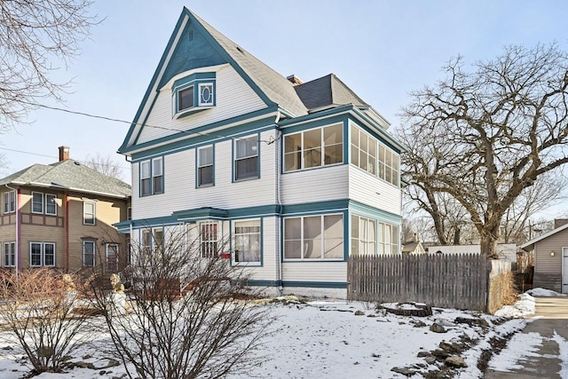 view of front of house with a sunroom