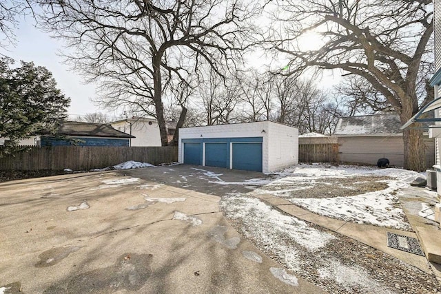 exterior space with a garage and an outdoor structure