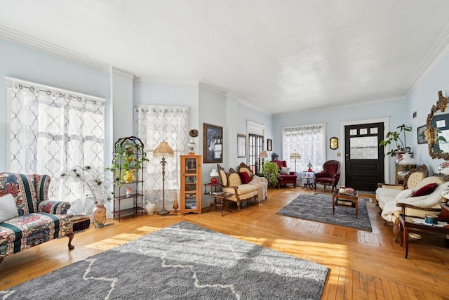 living room with hardwood / wood-style flooring and ornamental molding