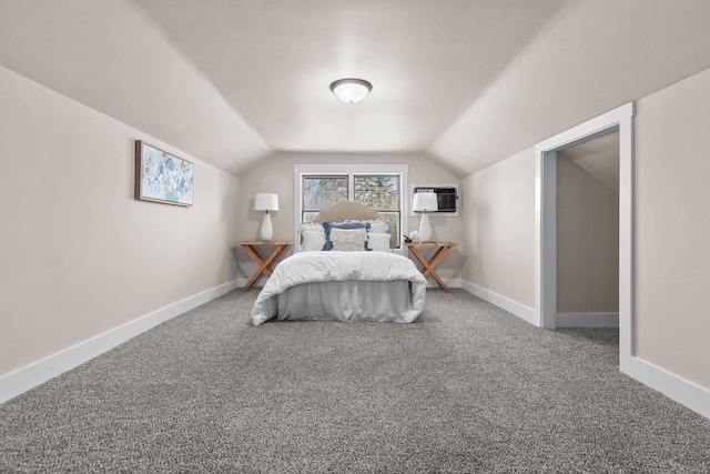 bedroom with lofted ceiling, carpet flooring, and a wall mounted AC