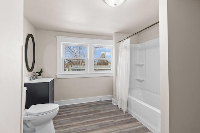 full bathroom featuring vanity, hardwood / wood-style floors, toilet, and shower / bath combo with shower curtain