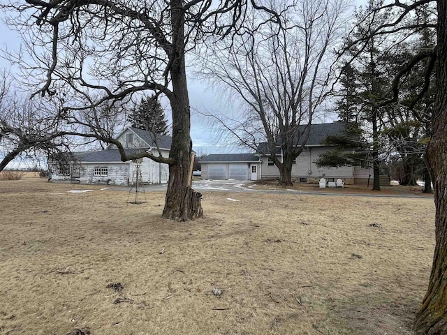 view of yard featuring a garage